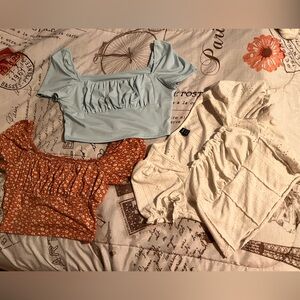 Trendy Cropped Blouse Trio in Baby blue, floral pink, and white
